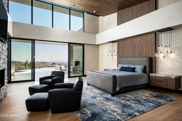 9643 E Cintarosa Pass, Scottsdale, AZ 85262 - bedroom featuring a high ceiling, wood finished floors, and access to exterior
