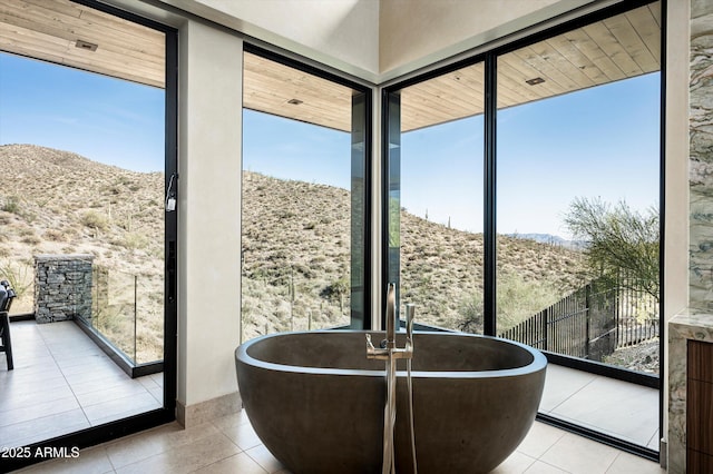 9643 E Cintarosa Pass, Scottsdale, AZ 85262 - interior space featuring a mountain view, tile patterned floors, and a wealth of natural light