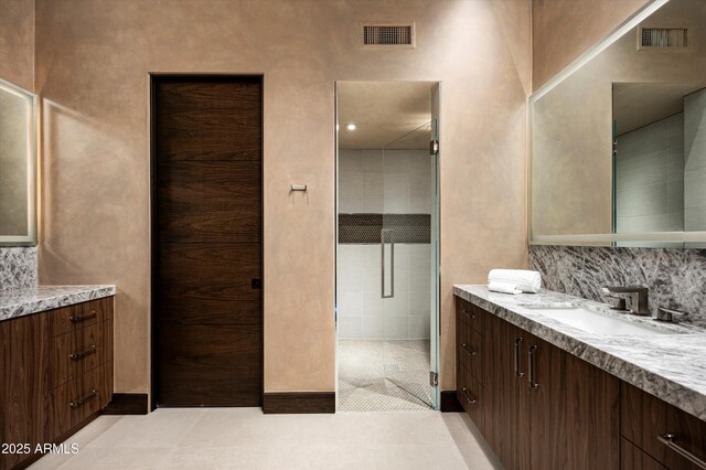 9643 E Cintarosa Pass, Scottsdale, AZ 85262 - full bathroom with visible vents, decorative backsplash, and vanity