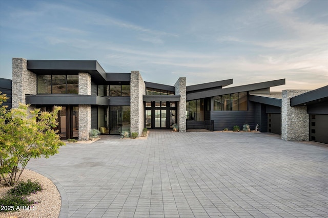 9643 E Cintarosa Pass, Scottsdale, AZ 85262 - contemporary home with stone siding and decorative driveway