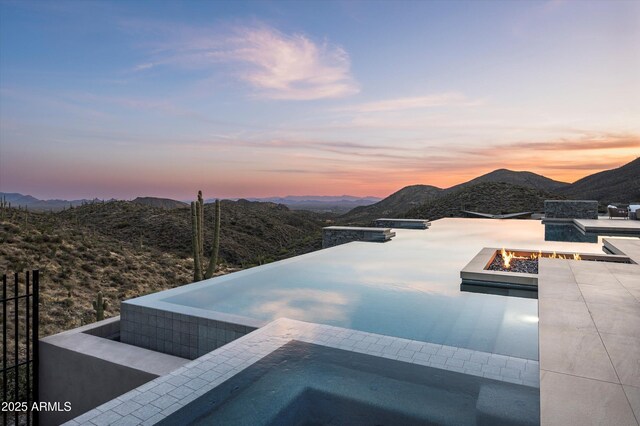 9643 E Cintarosa Pass, Scottsdale, AZ 85262 - view of pool featuring a patio area, an in ground hot tub, a fire pit, and a mountain view