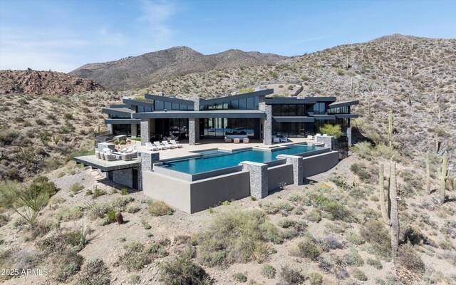 9643 E Cintarosa Pass, Scottsdale, AZ 85262 - outdoor pool with an outdoor living space, a mountain view, and a patio area