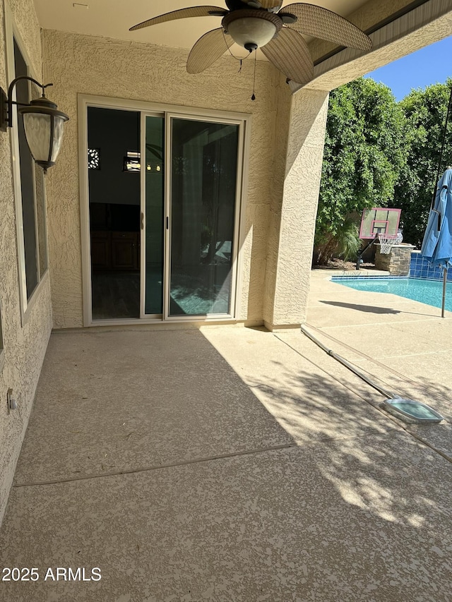 13259 W Flower St, Litchfield Park, AZ 85340 - view of patio with an outdoor pool and a ceiling fan