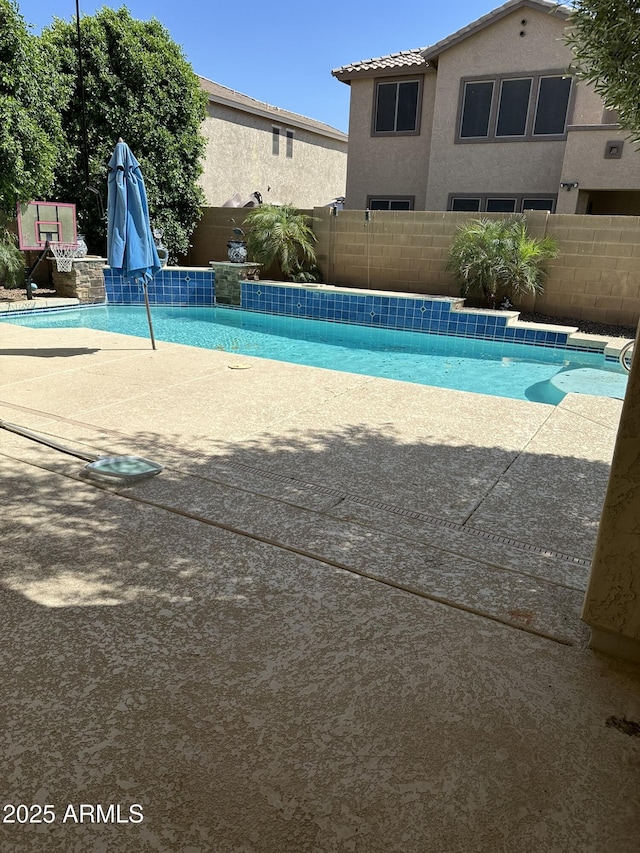 13259 W Flower St, Litchfield Park, AZ 85340 - view of swimming pool featuring a patio, a fenced in pool, and a fenced backyard