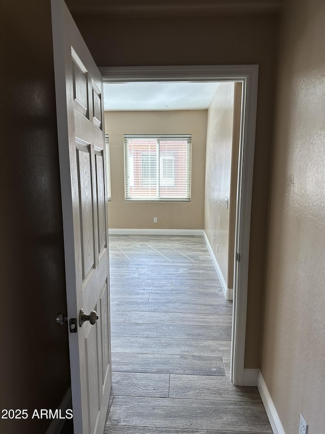 13259 W Flower St, Litchfield Park, AZ 85340 - hall with baseboards, wood finished floors, and a textured wall