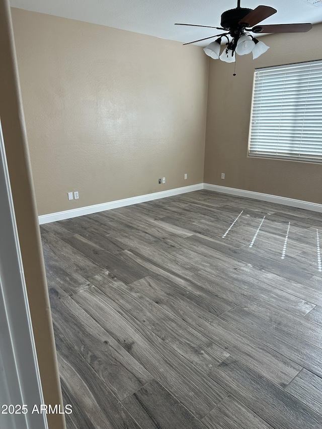 13259 W Flower St, Litchfield Park, AZ 85340 - empty room featuring a ceiling fan, wood finished floors, and baseboards
