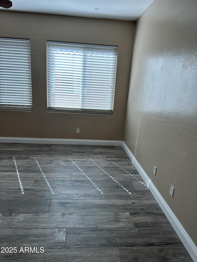 13259 W Flower St, Litchfield Park, AZ 85340 - spare room with baseboards and wood finished floors
