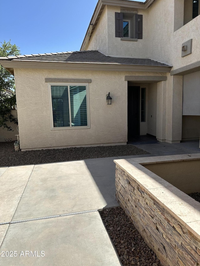 13259 W Flower St, Litchfield Park, AZ 85340 - exterior space featuring a patio and stucco siding