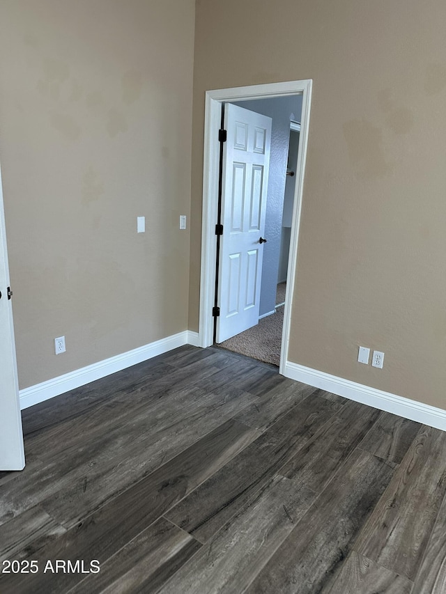 13259 W Flower St, Litchfield Park, AZ 85340 - unfurnished room with dark wood-style floors and baseboards