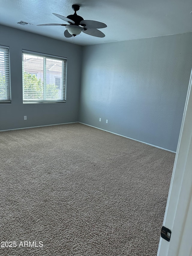 13259 W Flower St, Litchfield Park, AZ 85340 - unfurnished room featuring visible vents, a ceiling fan, carpet flooring, and baseboards