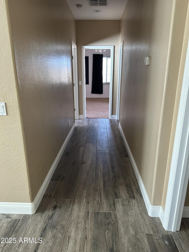 13259 W Flower St, Litchfield Park, AZ 85340 - hallway featuring baseboards, visible vents, and wood finished floors