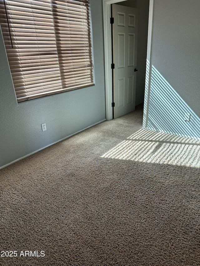 13259 W Flower St, Litchfield Park, AZ 85340 - carpeted empty room featuring baseboards