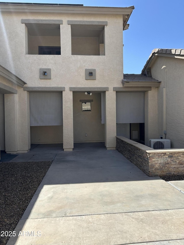 13259 W Flower St, Litchfield Park, AZ 85340 - view of front of house with stucco siding and ac unit