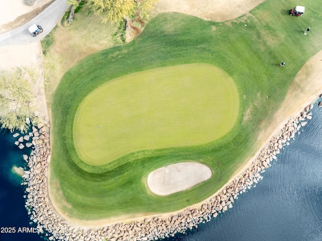 bird's eye view with a water view and golf course view