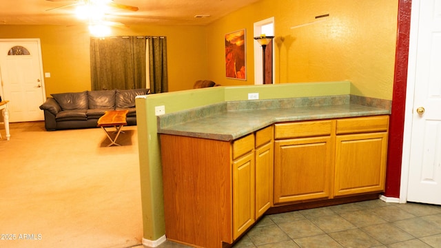 28921 N 220th Dr, Wittmann, AZ 85361 - kitchen with a ceiling fan, open floor plan, and a peninsula