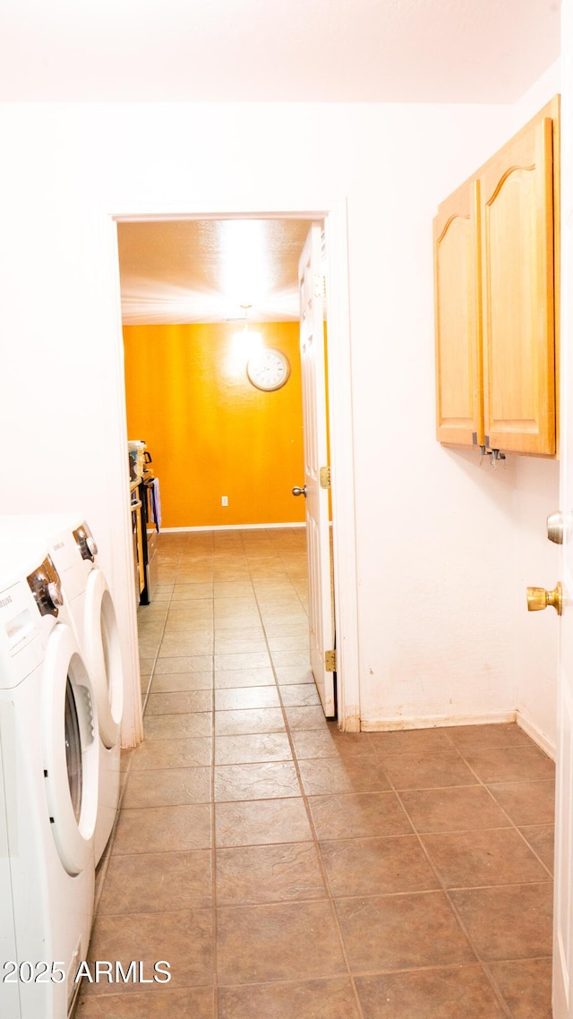 28921 N 220th Dr, Wittmann, AZ 85361 - washroom featuring washer / clothes dryer, cabinet space, and light tile patterned flooring