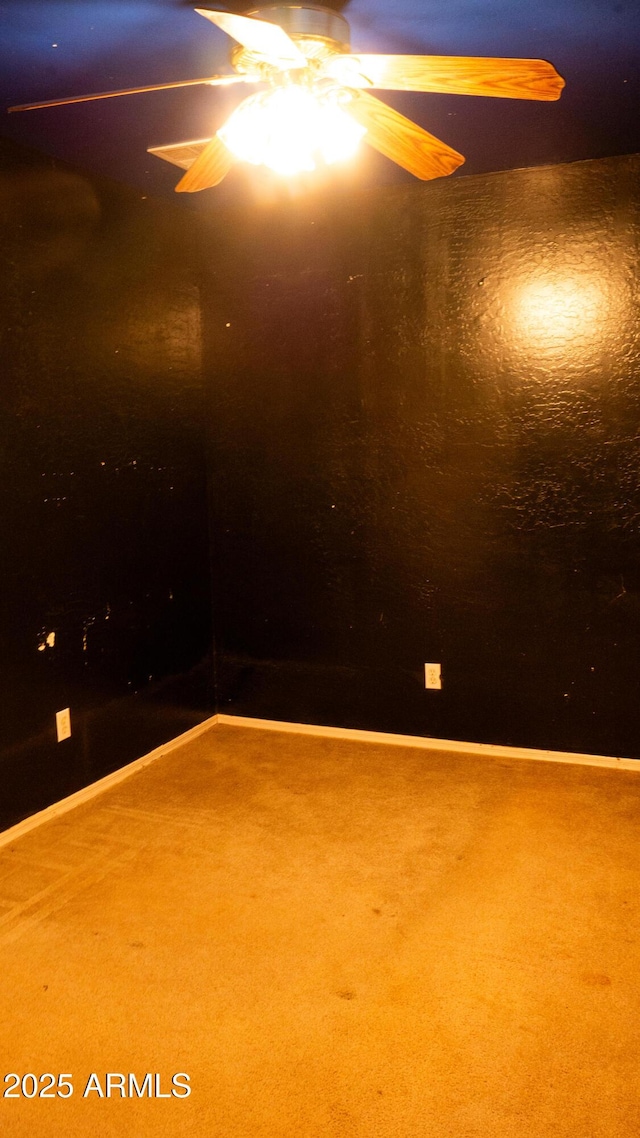 28921 N 220th Dr, Wittmann, AZ 85361 - spare room with ceiling fan, carpet flooring, and baseboards