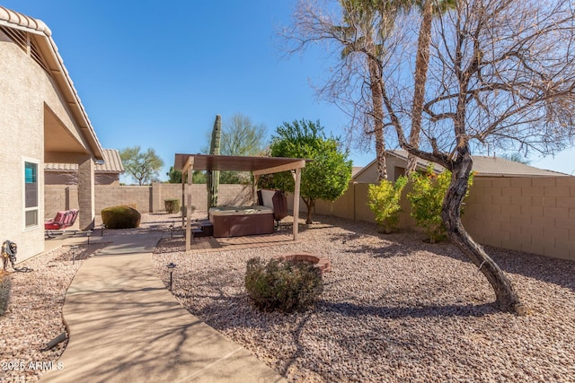 view of yard with a patio and a hot tub