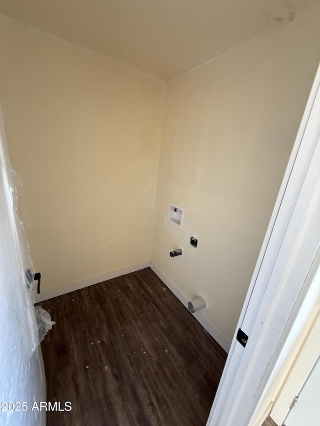 laundry room featuring washer hookup and dark wood-type flooring