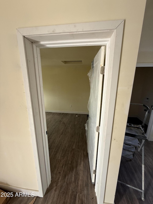 corridor with dark wood-type flooring