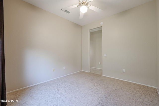 carpeted empty room with ceiling fan