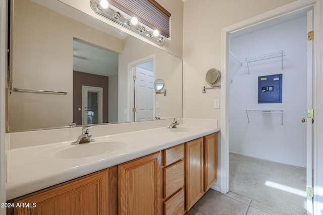 bathroom featuring tile patterned flooring and vanity