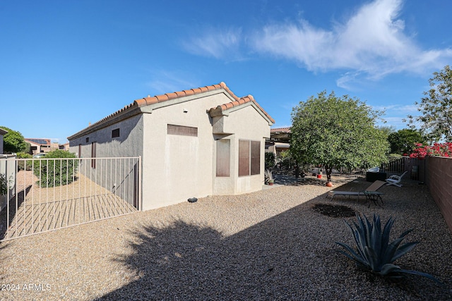 back of property featuring a patio