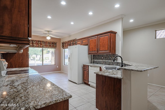 kitchen with sink, kitchen peninsula, white appliances, decorative backsplash, and ornamental molding