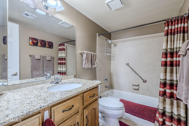 full bathroom with vanity, shower / bath combo, and toilet