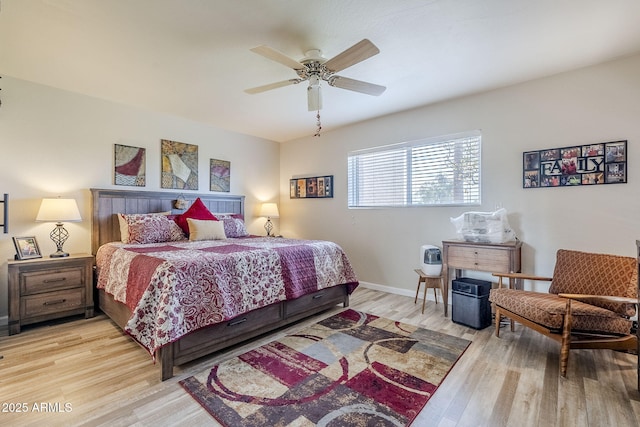 bedroom with ceiling fan and light hardwood / wood-style floors