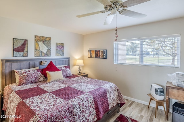 bedroom featuring light hardwood / wood-style flooring and ceiling fan