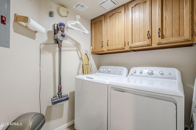 laundry area featuring cabinets and washer and clothes dryer