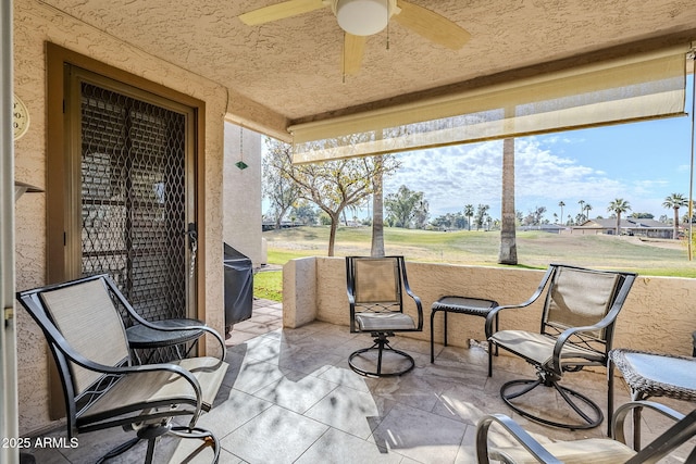 view of patio with ceiling fan and grilling area