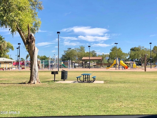 exterior space featuring a playground and a yard