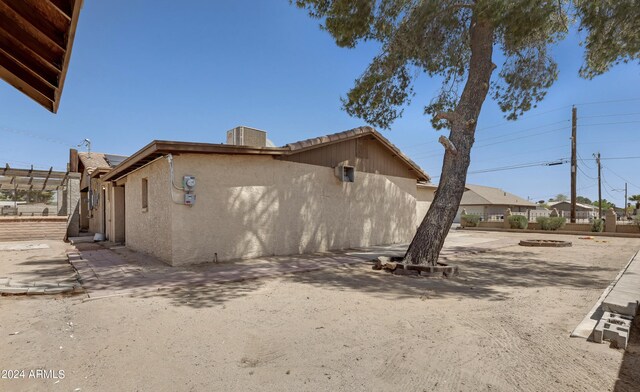 view of property exterior with a patio