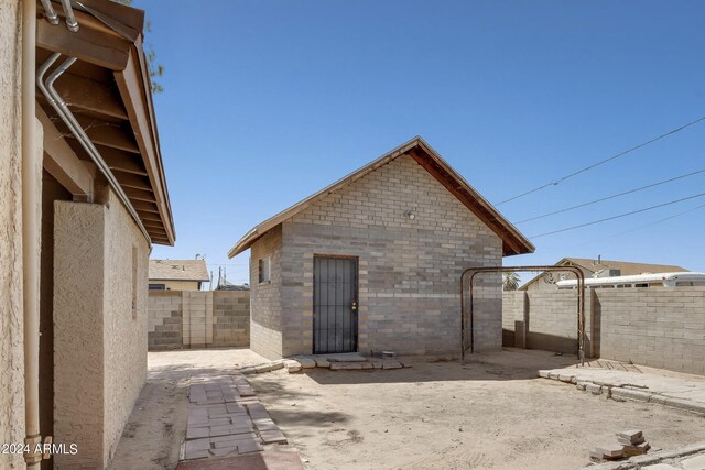 back of house with a patio area