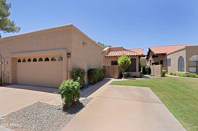 4039 E Paradise Dr, Phoenix, AZ 85028 - view of front of property with stucco siding, an attached garage, a front yard, driveway, and a tiled roof