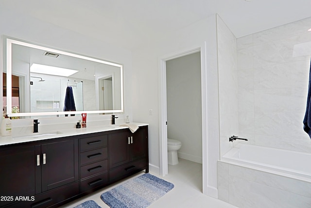 4039 E Paradise Dr, Phoenix, AZ 85028 - full bath featuring tiled shower, toilet, double vanity, tiled tub, and baseboards