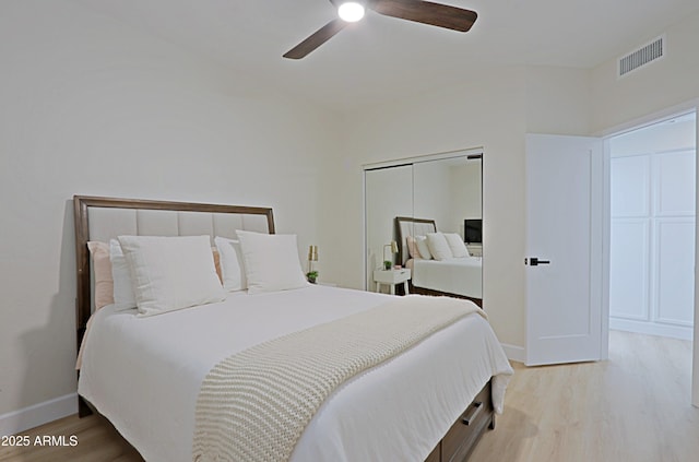 4039 E Paradise Dr, Phoenix, AZ 85028 - bedroom featuring wood finished floors, baseboards, a closet, and a ceiling fan
