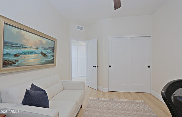 4039 E Paradise Dr, Phoenix, AZ 85028 - living area featuring light wood-style floors, baseboards, and a ceiling fan
