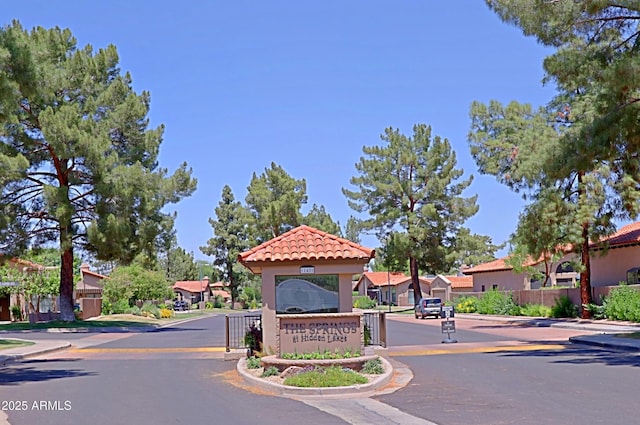 4039 E Paradise Dr, Phoenix, AZ 85028 - view of asphalt street with a residential view, curbs, and a gated entry