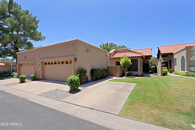 4039 E Paradise Dr, Phoenix, AZ 85028 - view of front of house with stucco siding, a tiled roof, a front yard, driveway, and a garage