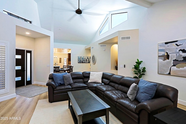 4039 E Paradise Dr, Phoenix, AZ 85028 - living area featuring high vaulted ceiling, light wood-style flooring, a ceiling fan, arched walkways, and baseboards