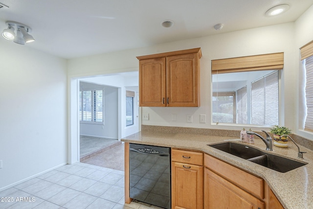 kitchen with light tile patterned flooring, light stone counters, a sink, dishwasher, and visible vents