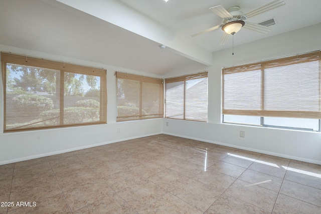 unfurnished sunroom featuring baseboards, lofted ceiling with beams, and tile patterned floors