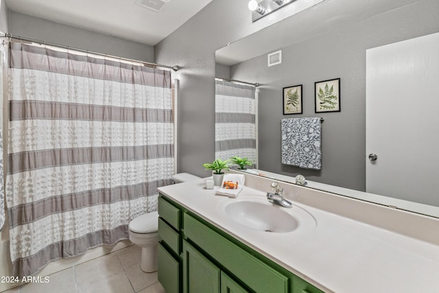 full bathroom featuring tile patterned floors, vanity, shower / tub combo, and toilet