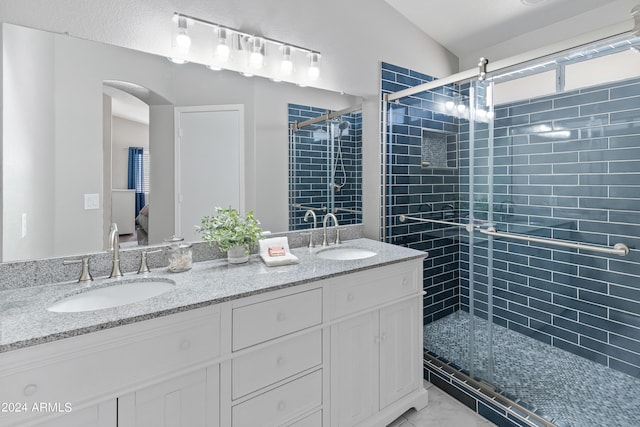 bathroom with vanity, an enclosed shower, and lofted ceiling