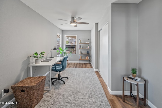 office with ceiling fan and hardwood / wood-style floors