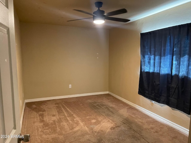 unfurnished room with carpet and ceiling fan