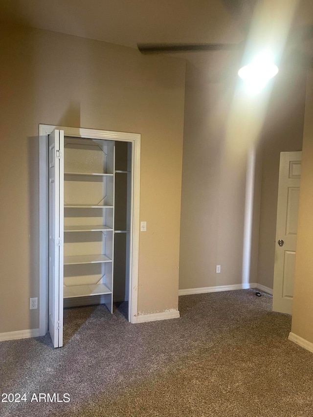 unfurnished bedroom with carpet flooring